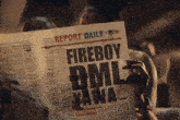a person holding a newspaper that says report daily on it