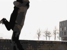 a man is holding a woman in his arms and they are hugging in the air .