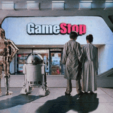a couple of people standing in front of a game stop