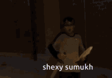 a person with a crown on their head and the words shexy sumukh behind them