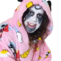 a woman wearing a pink blanket with mickey mouse and minnie on it