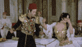 a man in a military uniform is dancing with a woman in a dress