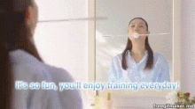 a woman is brushing her teeth in front of a mirror with the words it 's so fun you 'll enjoy training everyday