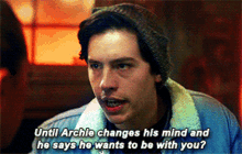 a man wearing a beanie and a denim jacket says until archie changes his mind