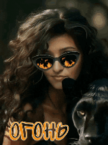 a woman wearing sunglasses is standing next to a black panther with the word ofohh written on the bottom