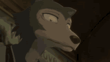 a close up of a cartoon character 's face with a sign in the background that says love