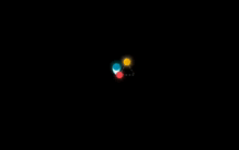 a black background with a circle of colored dots