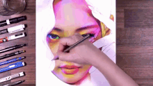 a person is drawing a woman 's face with a pencil that says schneider