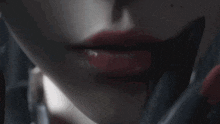 a close up of a woman 's face with blood on it .