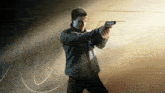 a man is holding a gun in front of a 007 sign