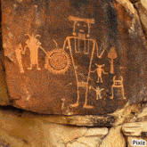 a picture of an ancient native american painting on a rock ..