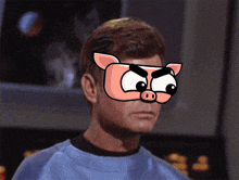 a man wearing a mask that looks like a pig with big eyes