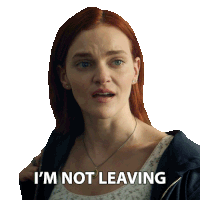 a woman with red hair has the words i 'm not leaving written on her face