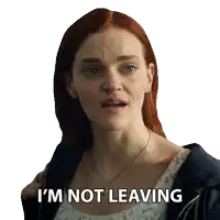 a woman with red hair has the words i 'm not leaving written on her face
