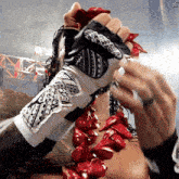 a person wearing a black and white glove with a sticker on it that says ' xtreme '