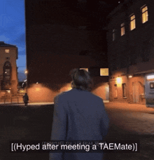 a man walking down a street with the words hyped after meeting a taemate on the bottom