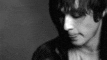 a black and white photo of a person 's face