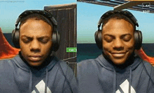 a man wearing headphones and a blue hoodie is making a funny face .