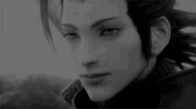 a black and white photo of a man with dreadlocks looking at the camera .