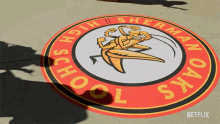 a logo for sherman oaks high school is painted on the sidewalk