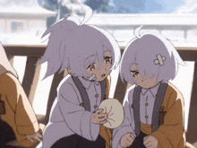 a girl with a bandage on her head is holding a piece of bread