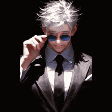 a man in a black suit with blue flames behind him