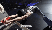 a man laying on a table with a sticker that says ' txt log ' on it