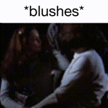 a blurry picture of a person with the words * blushes * on the bottom