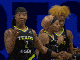 a female basketball player wearing a texas jersey
