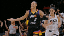 a female basketball player wearing a sky jersey