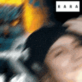 a blurred image of a person with the word " rare " on the bottom right