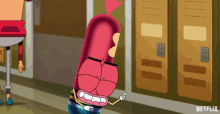 a cartoon character is pointing at something in a hallway with netflix written on the bottom