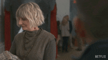 a netflix ad shows a woman holding a baby and says " you really fucked that up "