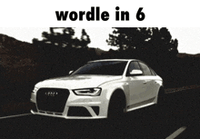 a white car is driving down a road with the words wordle in 6 written above it