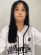 a young woman wearing a white shirt that says when yes