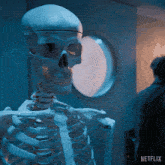 a skeleton is standing in front of a door that says netflix