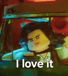 a lego woman is driving a car with the words i love it below her