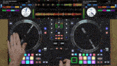 a person is playing music on a mixer that says rane on it