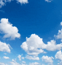 a blue sky with a lot of white clouds