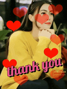 a woman in a yellow sweater is surrounded by red hearts that say thank you