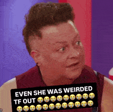 a man holding a sign that says ' even she was weirded tf out '