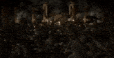 a blurred image of a group of people sitting around a table with candles