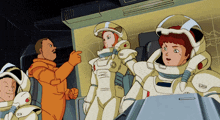 a group of astronauts are standing in a room and one of them is wearing a helmet that says ' a '