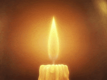 a close up of a candle with a flame coming out of it