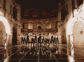 a group of people are dancing in a room with the words chinleyah on the bottom right