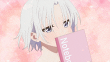 a girl with white hair is holding a notebook