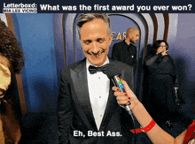 a man in a tuxedo is being interviewed by a woman with a caption that says letterboxd