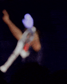 a man with his arms in the air wearing a shirt that says ' allianz ' on it