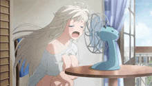 a girl is sitting at a table in front of a fan with animeflv.net written on the bottom