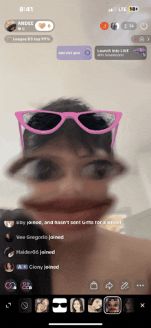 a phone screen shows a girl wearing pink sunglasses and the time 8:41